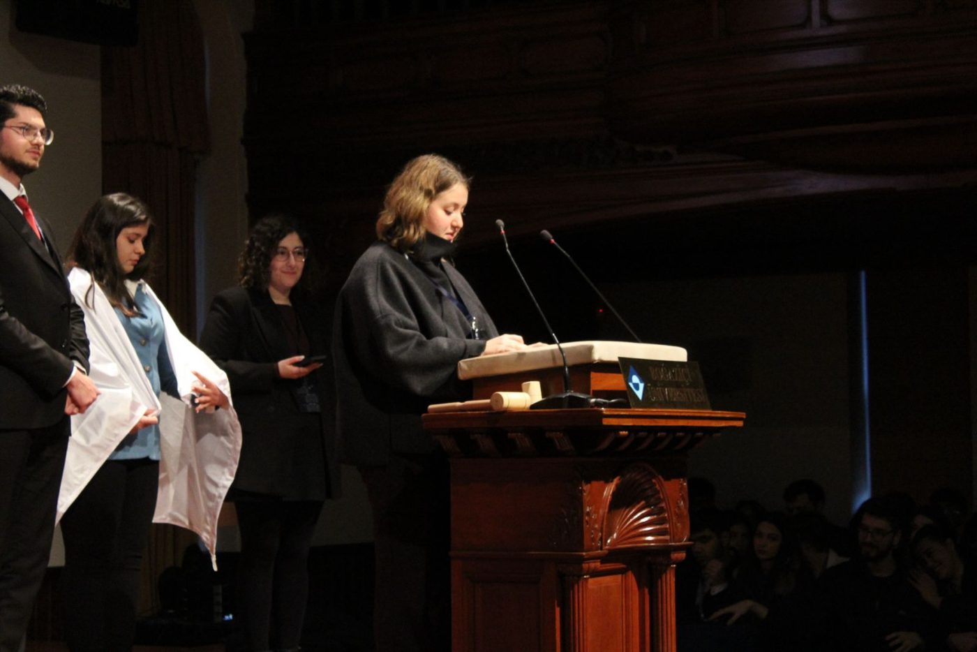 Nisa İltekin speaking at the Albert Long Hall podium